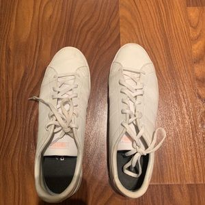 White and pink adidas woman’s shoes